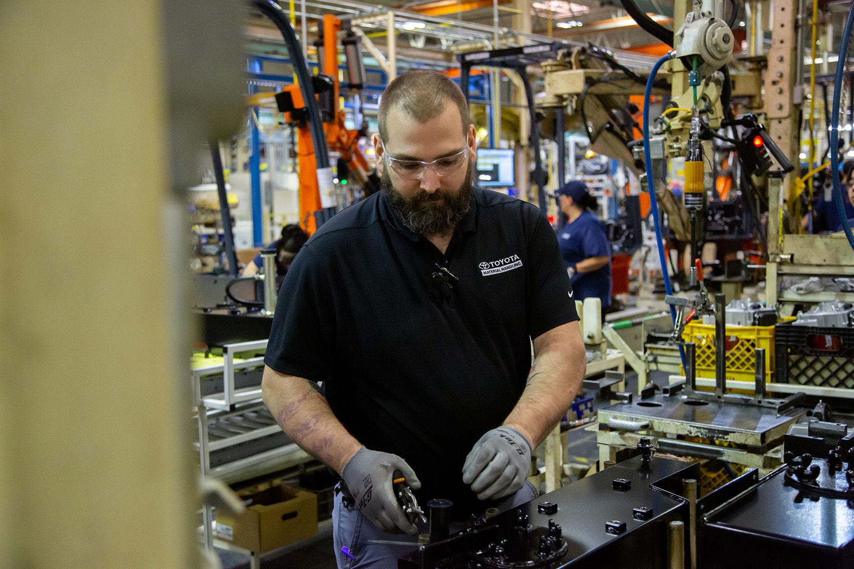 TMH Manufacturing Floor Associate white male working on manufacturing line
