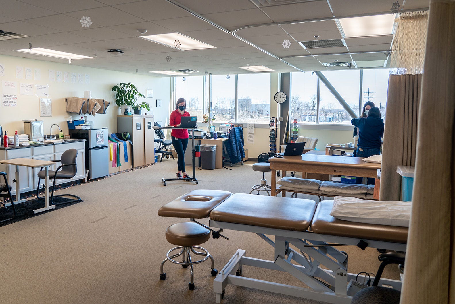 Toyota On-Site Physical Therapy toyota physical training room. physical therapist assisting patient