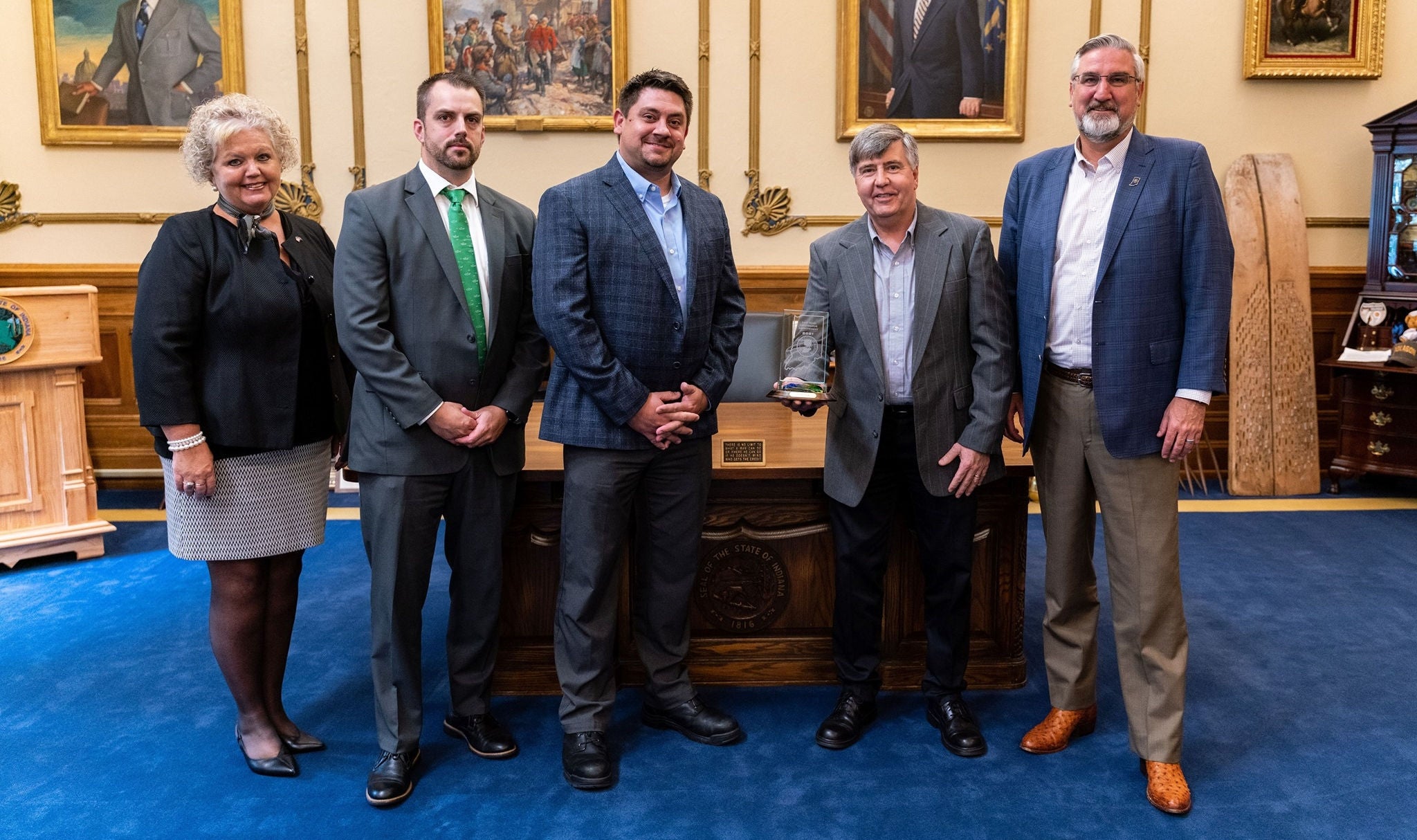 tmh employees accepting award from indiana governor